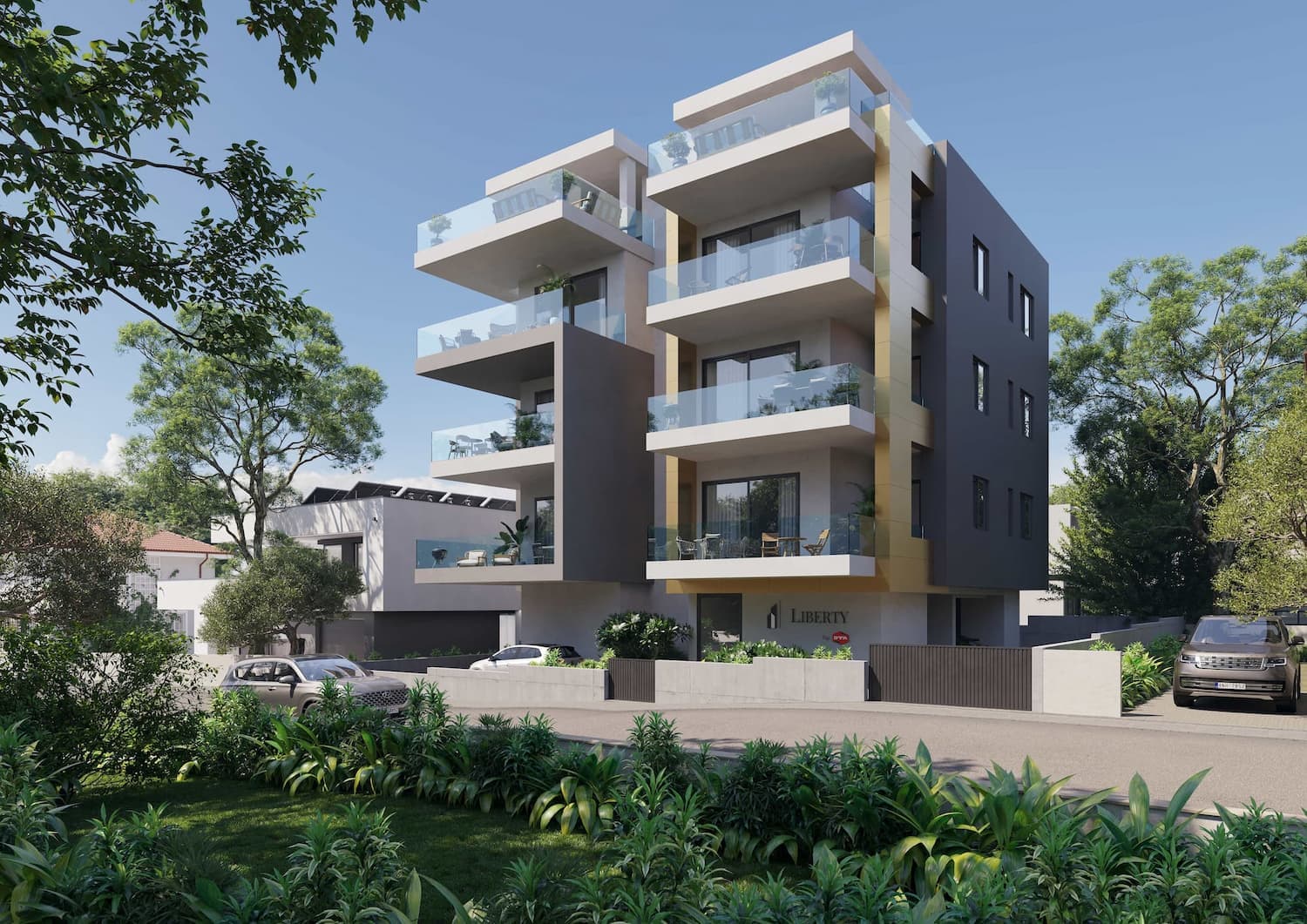 Corner view of the Urban Terraces Residence apartment building with landscaping and facade accents